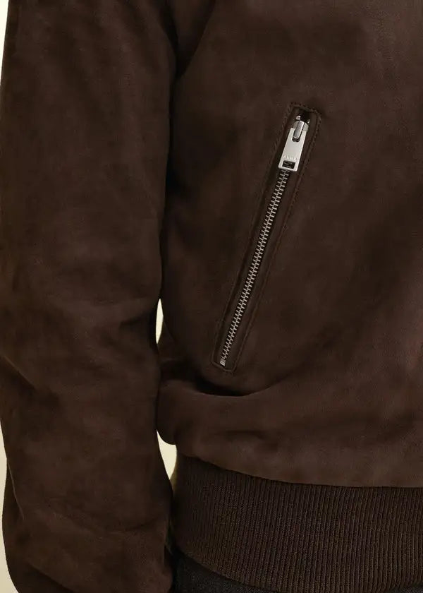 front zip-view Brown leather jacket with a zipper pocket on a beige background