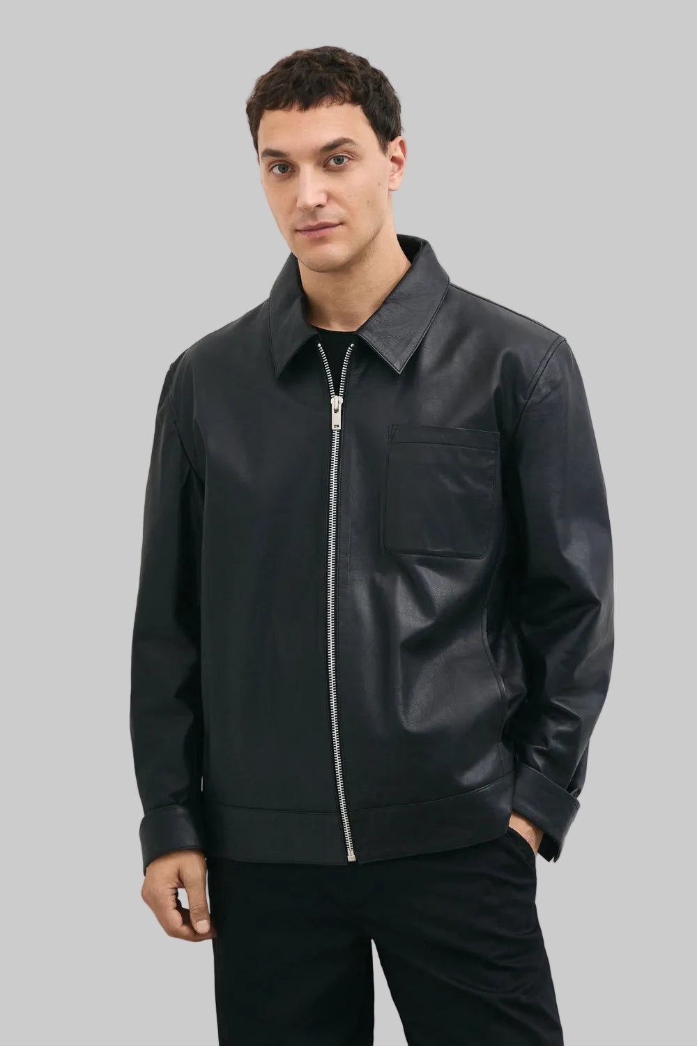 FRONT FULL POSE Men's black leather jacket made from premium full grain leather with front zipper closure, classic collar, and modern minimalist design by LEATHERTEXEU.