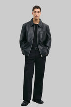 FRONT POSE Men's black leather jacket made from premium full grain leather with front zipper closure, classic collar, and modern minimalist design by LEATHERTEXEU.